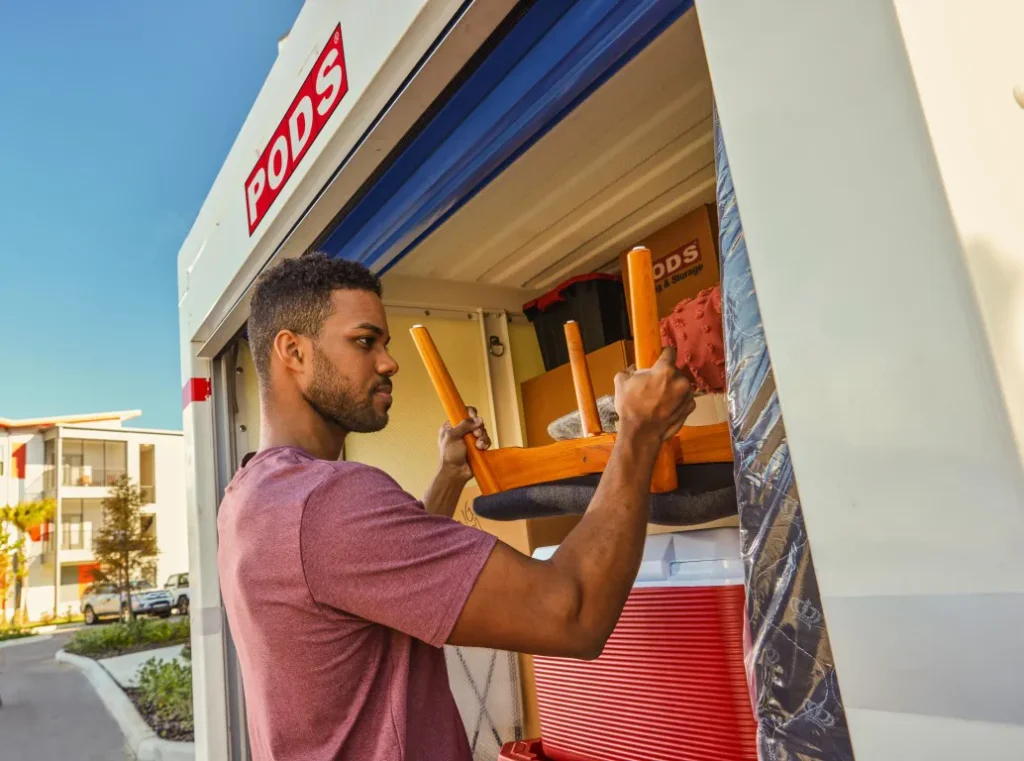 Man loading a PODS container